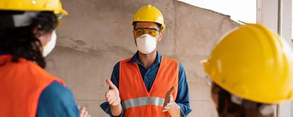 two workers undergoing OSHA covid training to keep covid-19 health and safety protocols
