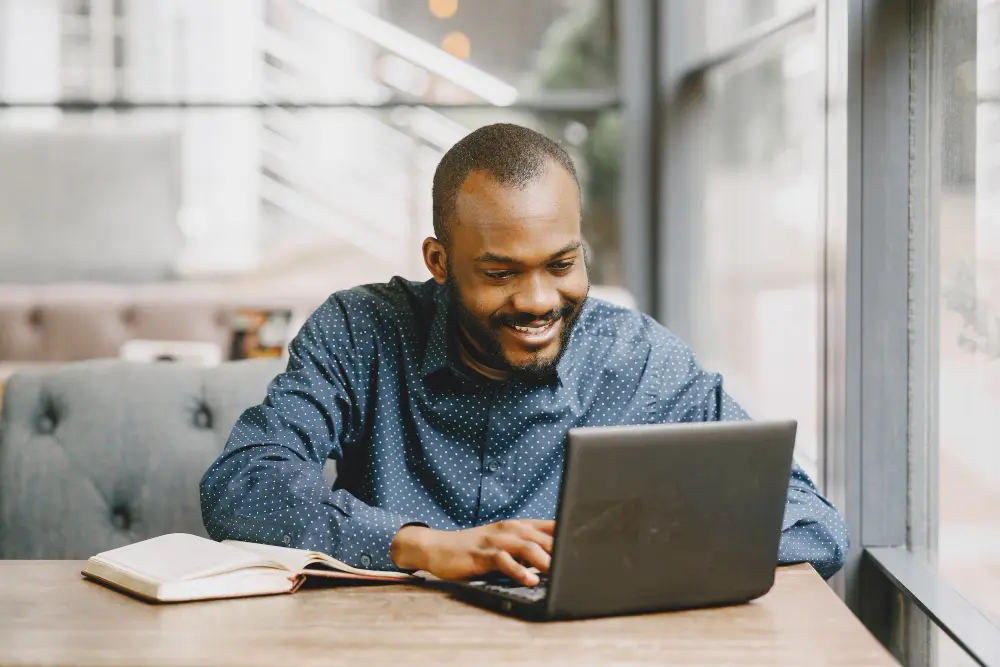 african-american-man-working-laptop-writing-notebook-man-with-beard-sitting-cafe (2) african-american-man-working-laptop-writing-notebook-man-with-beard-sitting-cafe (2)