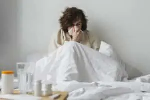 Free photo young sick man staying in his bed