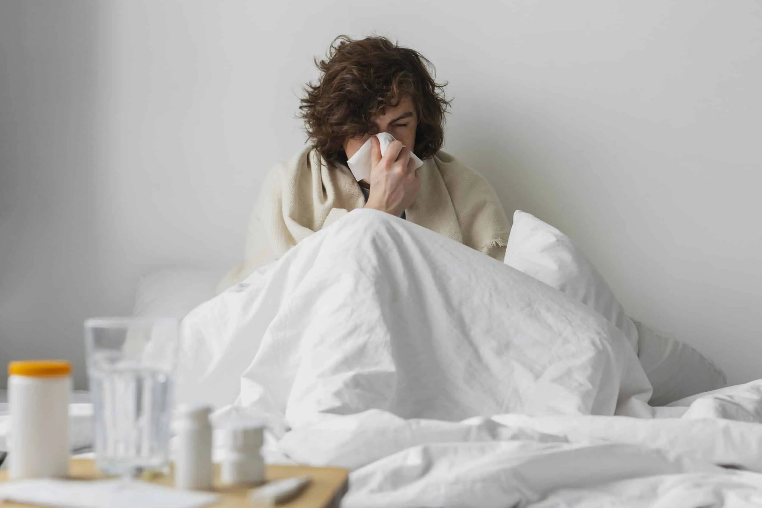 young-sick-man-staying-his-bed Free photo young sick man staying in his bed